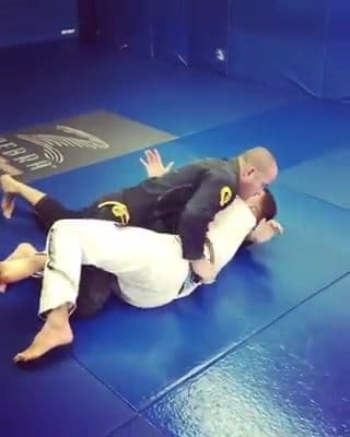 2 variations of half guard sweeps: same side vs. cross grip