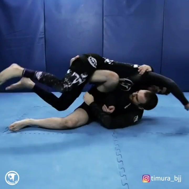 Advanced setup to saddle from guard. Texas Cloverleaf by @timura_bjj