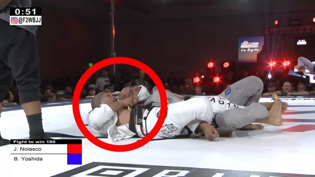 Baret Yoshida sinks a beautiful assassin choke