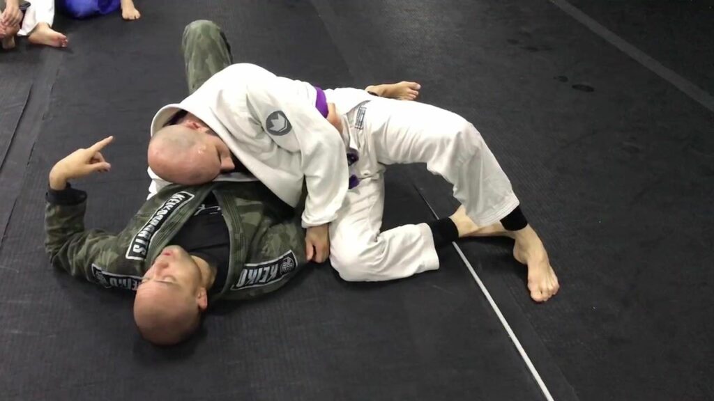 Easy sweep from kuzure kesa gatame (modified scarf hold) by Gile Huni BJJEE.com. ...