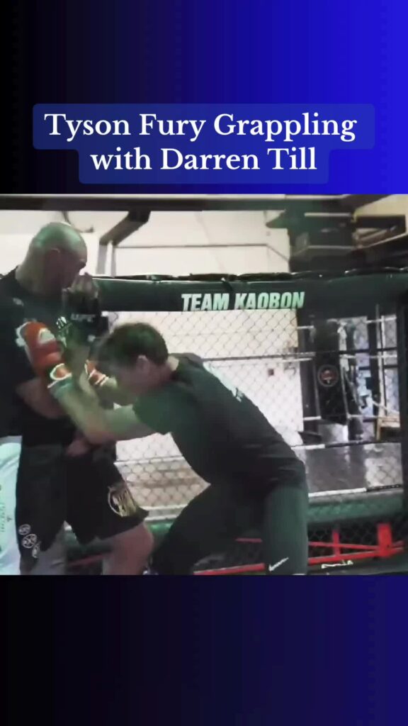 Former heavyweight champion Tyson Fury grappling with former UFC fighter Darren