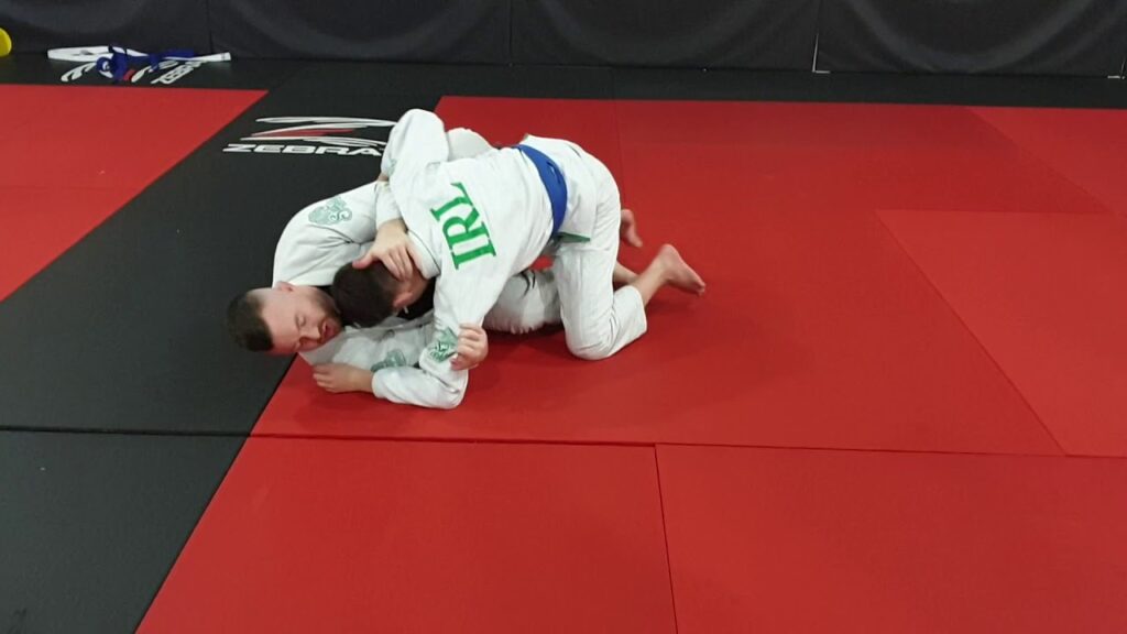 Hook sweep to inverted armbar