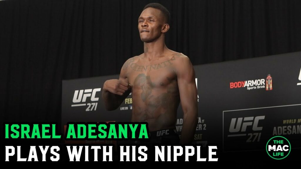 Israel Adesanya plays with his nipple at UFC 271 Official Weigh-Ins