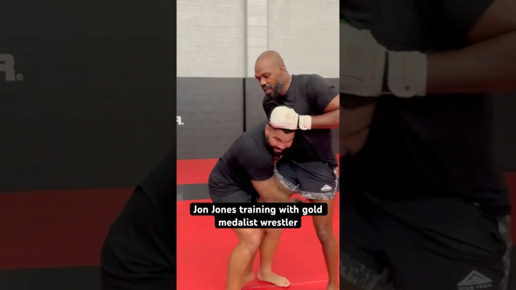 Jon Jones lands knee on Olympic gold medalist wrestler, Gable Steveson.