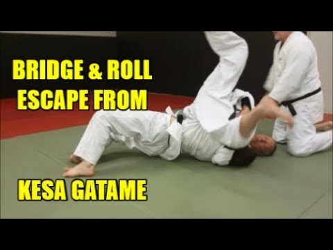 KESA GATAME: BRIDGE AND ROLL ESCAPE