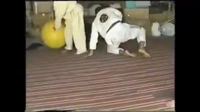 Rickson Gracie rolling in his garage with his students