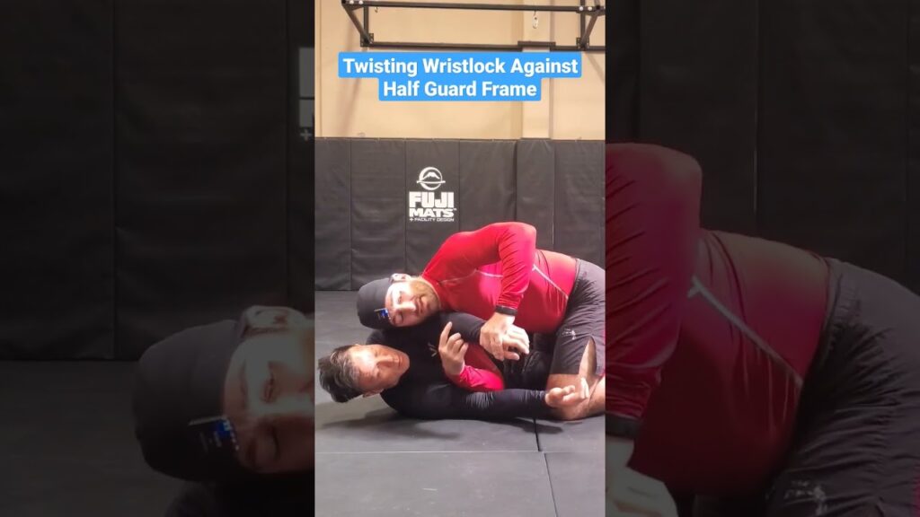 Twisting Wristlock Against Half Guard Frame